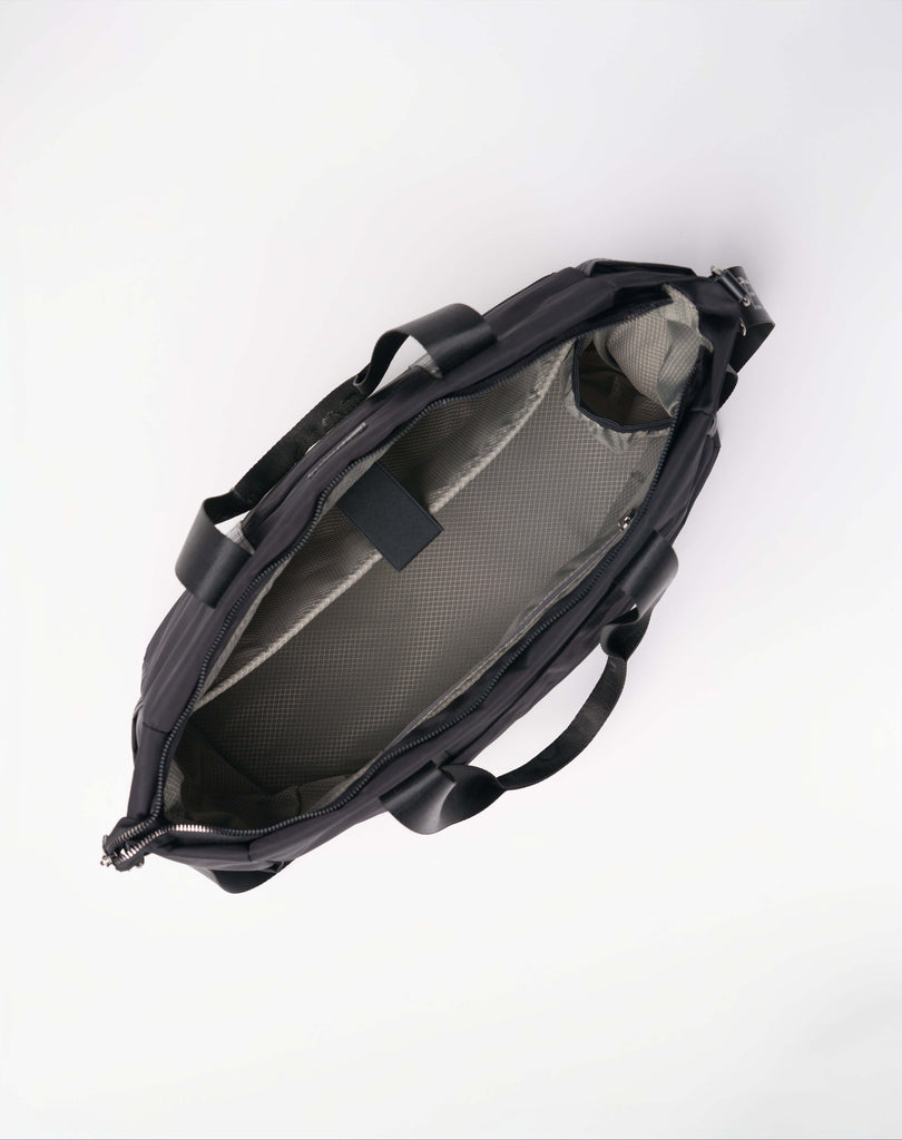 Kaigeo Onyx tote shown with open interior and laptop pocket
